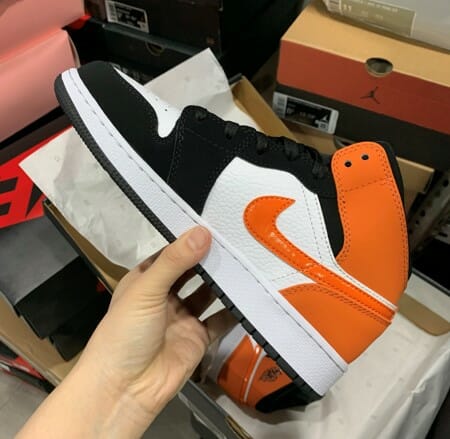 Air Jordan 1 Mid Black Orange Buckled